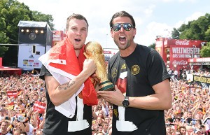 BERLIN, GERMANY - JULY 15: Kevin Grosskreutz and Roman Weidenfeller celebrate during the German team victory ceremony on July 15, 2014 in Berlin, Germany. Germany won the 2014 FIFA World Cup Brazil match against Argentina in Rio de Janeiro on July 13. (Photo by Markus Gilliar - Pool /Getty Images)
