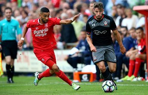 OLDENZAAL, NETHERLANDS - JULY 27: (L-R) Hakim Ziyech of Enschede challenges Sam McQueen of Southampton during the friendly match between Twente Enschede and FC Southampton at Q20 Stadium on July 27, 2016 in Oldenzaal, Netherlands. (Photo by Christof Koepsel/Getty Images)